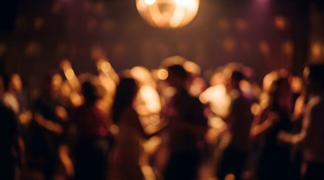 Crowd of people raising hands during energetic nighttime celebration in dimly lit venue with motion blur effect