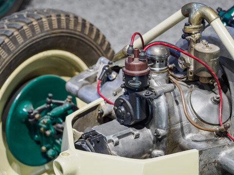 View of the engine section of an old vintage car without bodywork.