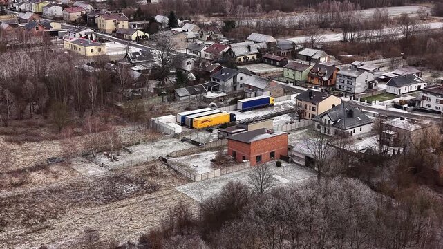 Parked DHL trailers at regional freight terminal from drone 14.01.2026 Poland, Europe