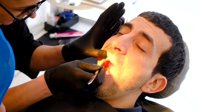 A man at a dentist appointment. Selective focus.