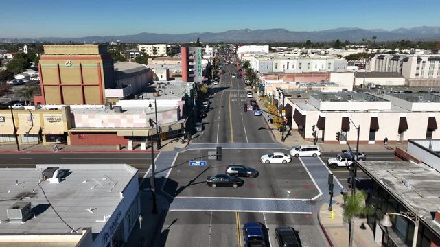 Bellflower, California, USA - Drone Aerial View Over Bellflower Boulevard and Flower Street With Local Shops, Restaurants, Storefronts, Commercial Buildings and Downtown Business District o