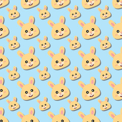 Obraz premium cute seamless pattern with cartoon yellow bunny faces on pastel blue background