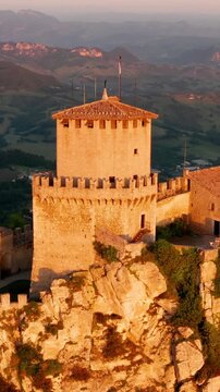 Flying over the amazing hilltop fortresses on Monte Titano in San Marino. San Marino one of the smallest countries in the world. Vertical Video.
