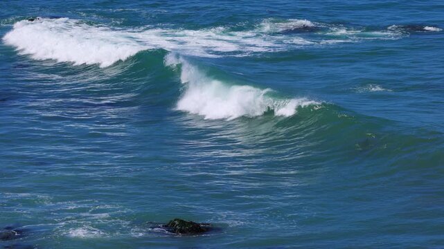 Slow motion shot of ocean waves and a windy day. Shot in Monterey California.