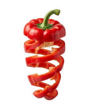Floating red bell pepper cut into a continuous spiral shape as transparent PNG
