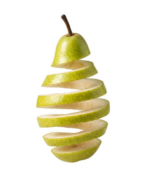 Fresh green pear cut into spiral floating slices as isolated object