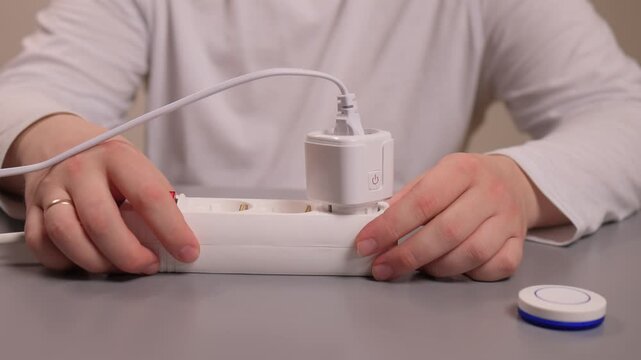 Smart plug handson setup. User demonstrates quick smart socket operation. Individual showcases effortless installation and immediate control of smart electrical devices