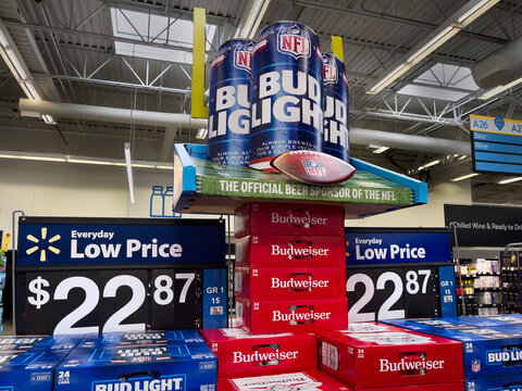 NORTH PORT, FLORIDA - SEPTEMBER 23, 2026 : Budweiser and Bud Light beer NFL football grocery store display. Anheuser-Busch InBev is the official beer sponsor of the National Football League.