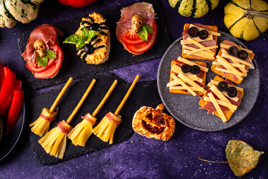 Halloween appetizers with pumpkin hummus deviled eggs and mummy snacks