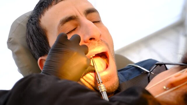 A man at a dentist appointment. Selective focus.