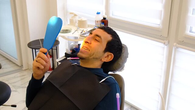 A man at a dentist appointment. Selective focus.