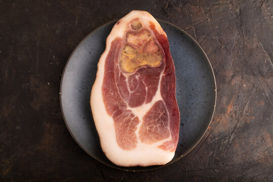 Dry-aged steak, Pork ham on black concrete, top view, close up