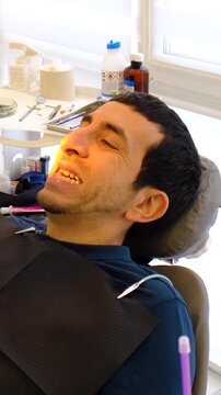 A man at a dentist appointment. Selective focus.