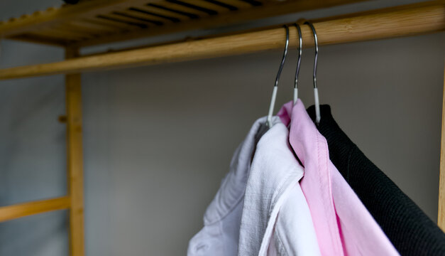 Clean clothing display on wooden hanger rack