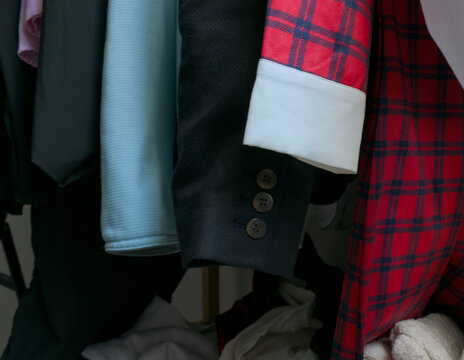 Detailed view of hanging clothes and plaid