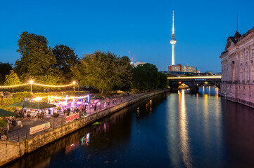 Berlin TV Tower Above Illuminated Market by the Spree at Night © Peter