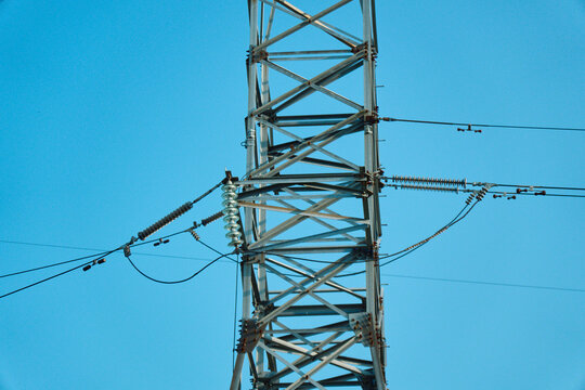 Low angle close up view of a strategic electrical distribution framework grid