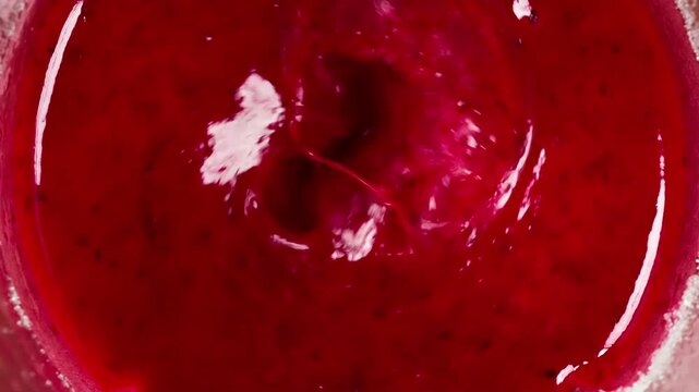 Berry Mousse in Blender. Blender creates a berry funnel with sugar, pink bubbles and a spray of mousse flying in the screen