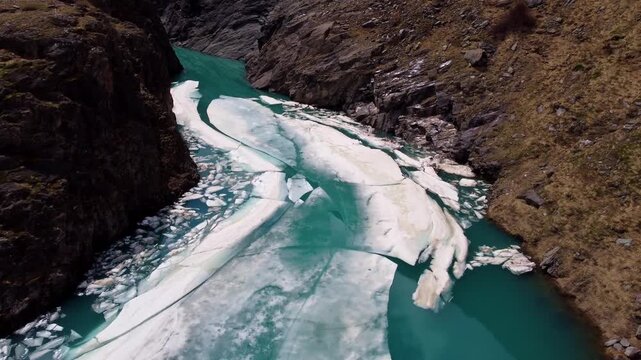 Aerial View of Glacial Inflow with Floating Ice Sheets Between Rocks, Grossglockner, Austria