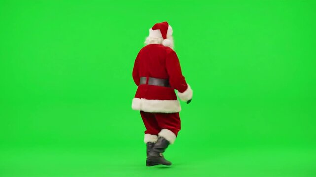 Santa Claus wearing traditional red suit dancing joyfully against a solid green screen background