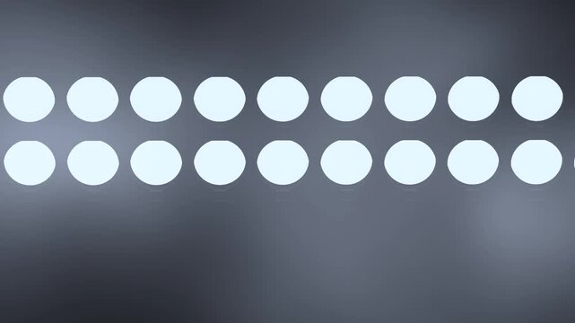 String of Glowing White Bokeh Lights Pulsing on a Dark Background