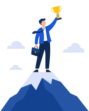 Successful businessman standing on top of a mountain holding a golden trophy as a symbol of achievement