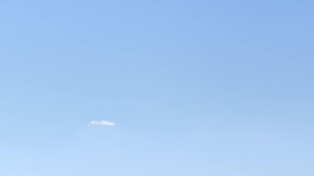 Cirrocumulus clouds in the light blue sky
