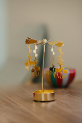 Golden reindeer christmas rotating candle holder © Iryna