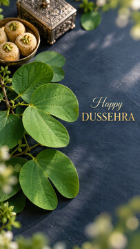 Happy Dussehra greeting with sacred Shami leaves and traditional Indian sweets, Vijayadashami festival background celebrating prosperity, blessings and victory of good over evil
