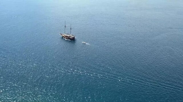 Panoramic aerial view of Taka Makassar sandbar surrounded by shallow turquoise water