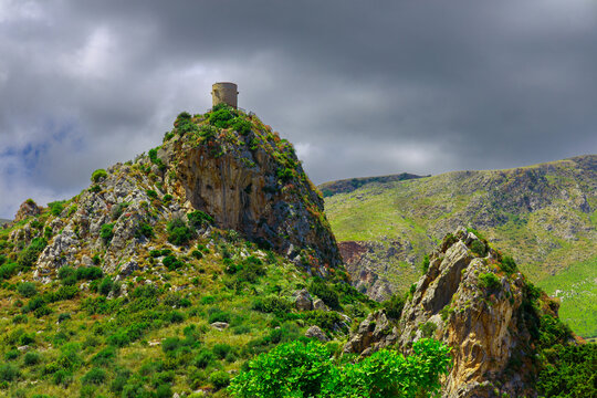 dramatic landmark watch tower on a top of mountain moody overcast cloudy weather in country side highland place