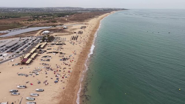 Aerial view of crowded armacao de pera beach in portugal