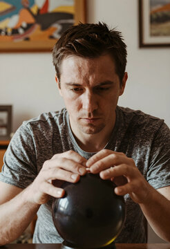 Future prediction and business strategy, man looking into a crystal ball with focus and concentration in a home office environment for decision making