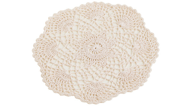 Isolated delicate light beige handmade crochet doily with intricate pattern for elegant home decor