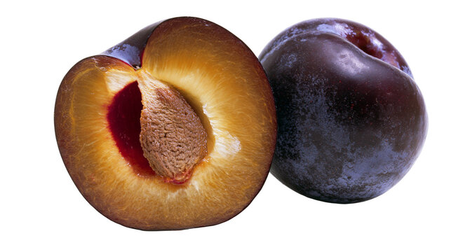 Isolated whole and halved ripe plums with visible pit, showcasing fresh juicy fruit
