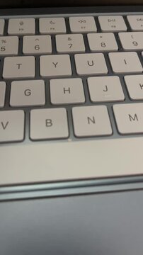 Sad face sticky note over laptop keyboard job dissatisfaction