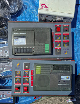 Polop, Spain - May 10, 2026.Vintage Roycan Ekolab ECL Personal Language Lab cassette recorders for sale at outdoor flea market in Spain