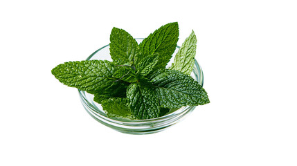 Isolated fresh green mint leaves in a small clear glass bowl, vibrant and aromatic herb © Diego