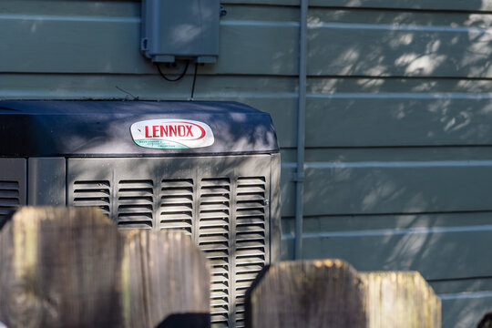 New Orleans, LA, USA - August 29, 2026: Closeup of a Lennox Air Conditioning Unit on the Side of an Historic Uptown House 