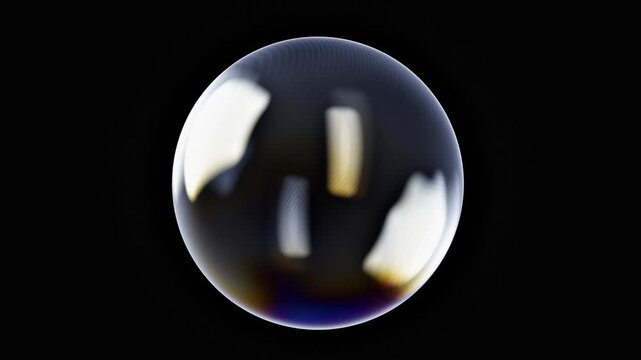 Soap bubble slowly turning with light reflections on black background
