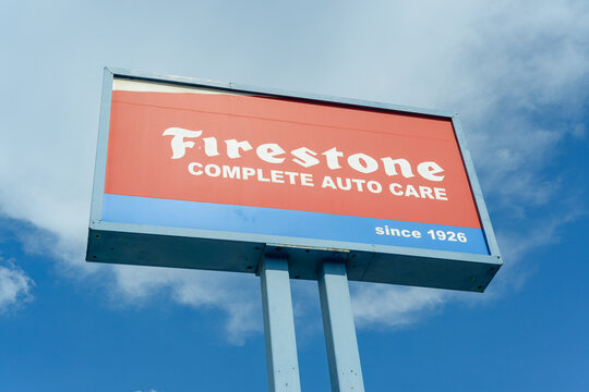 New Orleans, LA, USA - September 15, 2026: "Firestone: Complete Auto Care" Sign on Sky Background in Downtown New Orleans