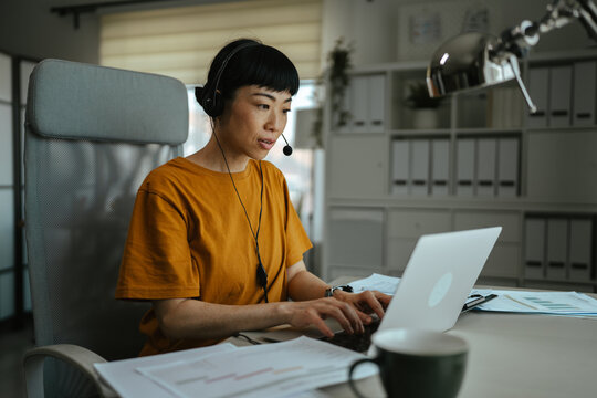 Asian woman working remotely having online meeting