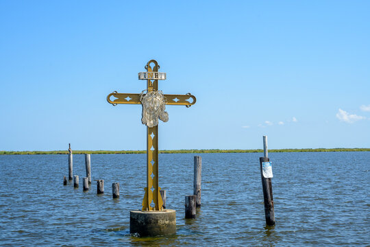 Crucifix in the Water  as Memorial to Victims of Hurricane Katrina at the entrance of the Mississippi River Gulf Outlet (MRGO) at Shell Beach, LA, USA