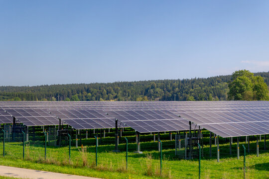 Green energy, Field of solar cell panels in countryside with mountain, Photovoltaic cell is an electrical device that converts the energy of light directly into electricity by the photovoltaic effect.