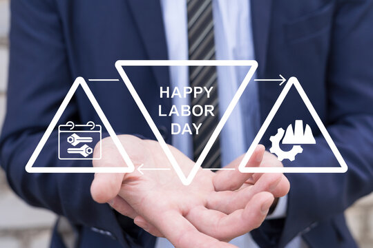 Concept of Happy Labor Day National Holiday Weekend. Businessman using virtual touchscreen sees the inscription HAPPY LABOR DAY.