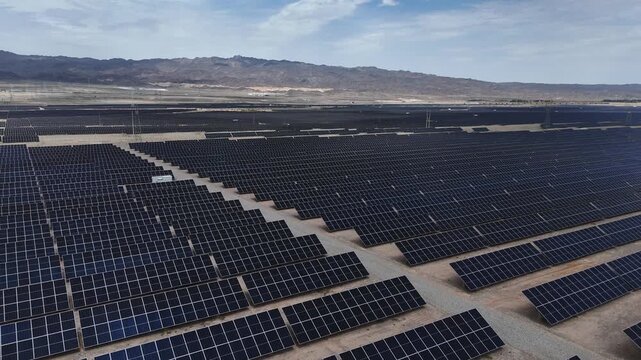 Aerial view of vast solar panel array power station