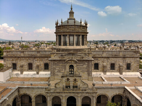 Aerial view of the historic Hospicio Cabanas with its iconic dome, stone architecture, and surrounding urban landscape in Guadalajara, Jalisco, Mexico.