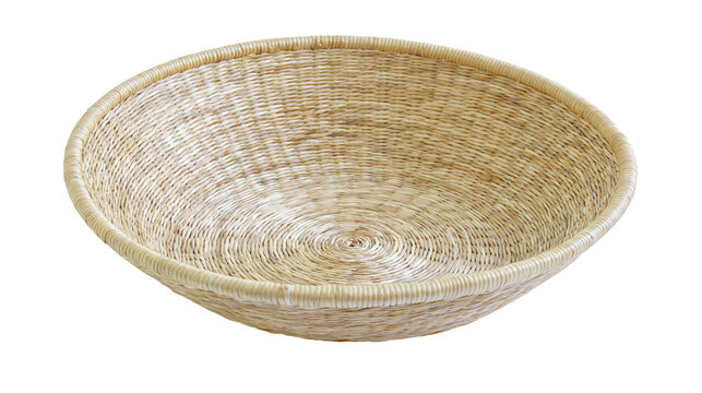 Isolated handcrafted round shallow natural fiber woven basket, perfect for rustic home decor