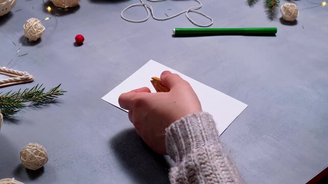 Using hot glue Storytelling of creating craft Christmas greeting card holiday present. Tactile hand-on activity. Master class progress of creative me-made gifts. Seasonal domestic life micro moment