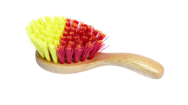 Isolated household cleaning brush with wooden handle and vibrant two-tone yellow red bristles